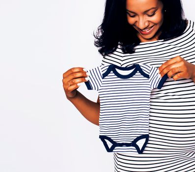 pretty young african-american pregnant woman posing isolated on white background, lifestyle people concept close up