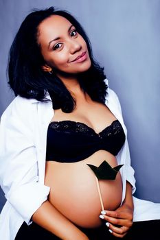 young pretty african american woman pregnant happy smiling, lifestyle people concept copyspace close up