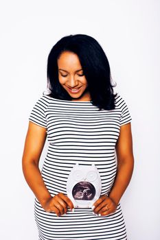 young pretty african american woman pregnant happy smiling, posing on white background isolated , lifestyle people concept copyspace close up