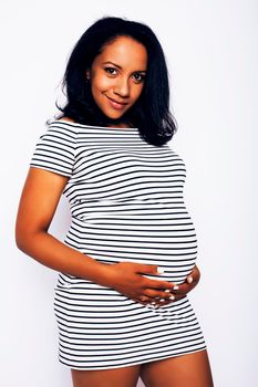 young pretty african american woman pregnant happy smiling, posing on white background isolated , lifestyle people concept copyspace close up