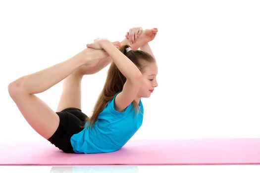 Girl gymnast performs an acrobatic element on the floor.The concept of childhood, sport, a healthy lifestyle, physical development of personality. Isolated on white background.