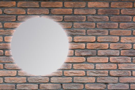 Round mirror near brick wall
