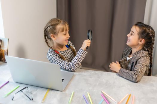 Two little girls doing their school homework