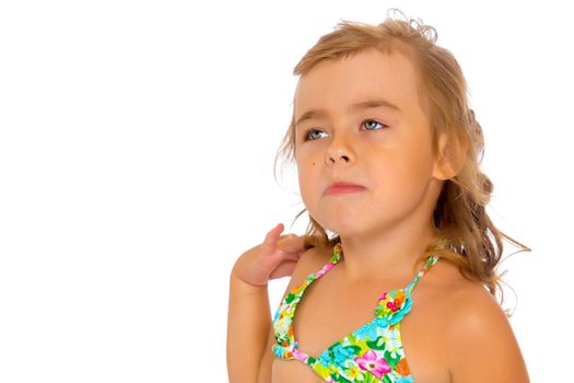 Tanned little girl in a swimsuit. The concept of summer family vacations in the sea. Happy childhood. Isolated on white background.