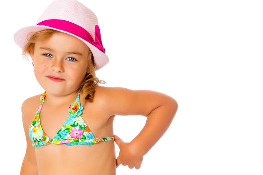 Beautiful little tanned girl in a swimsuit and a hat. The concept of summer family vacations, rest on the sea, beautiful tan. Isolated on white background.