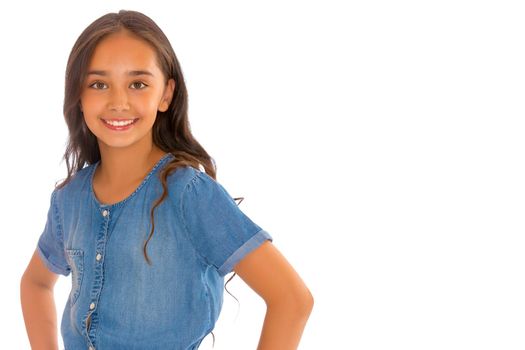 Portrait of a beautiful asian teenage girl with long black hair, in denim overalls. The concept of advertising a healthy lifestyle, beauty and fashion. Isolated on white background.