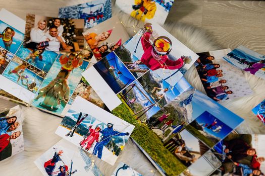 photo books lie near the fireplace at christmas