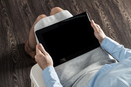 close-up of female hands with a computer tablet