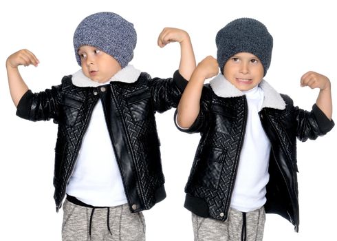 Studio portrait of boys in black leather jackets.Isolated on white background.