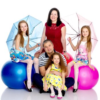 Happy family with young children. The concept of family happiness and development of children. Isolated on white background.