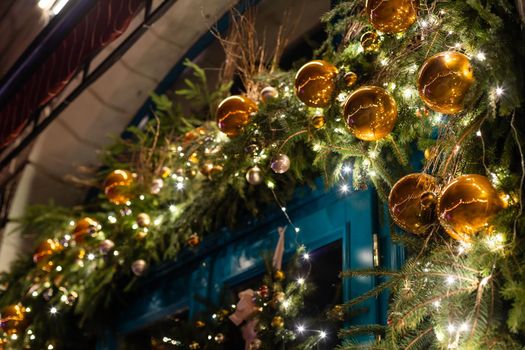 street Christmas decorations: a wreath with balls and garlands.