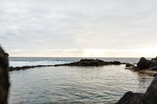 Old stone pier in sunset time at Tenerife, Canary Islands, Spain.
