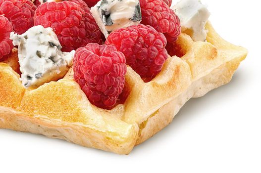 Closeup of french waffles with raspberries and dorblu cheese isolated on white background