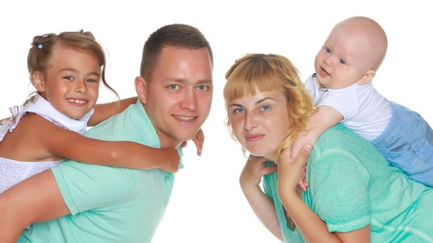 Happy family with young children. The concept of family happiness and development of children. Isolated on white background.