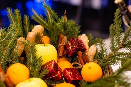 christmas composition in basket with oranges and fir tree