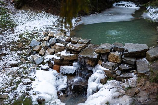 Frozen river in winter landscape.