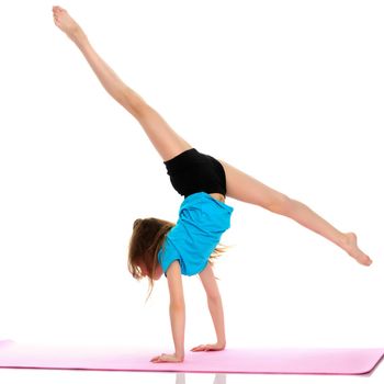 A gymnast girl stands on her hands. The concept of strength, health and sport. Isolated on white background.