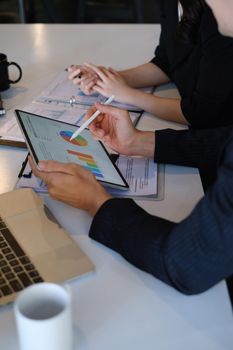 Fund managers team researching and analysis Investment stock market by paperwork at home offlice