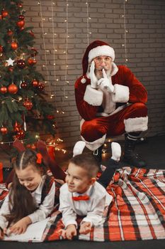 Children at home, decorated for Christmas. Santa's mail.