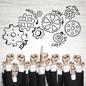 Group of hands of businesspeople showing gestures on wooden background