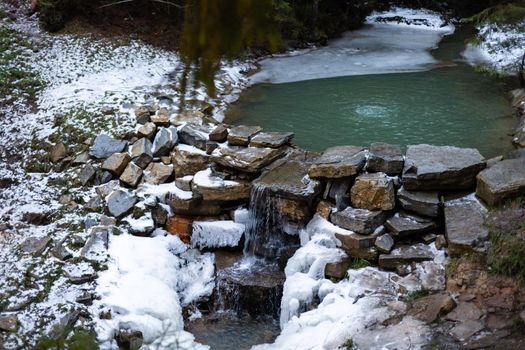 Frozen river in winter landscape.