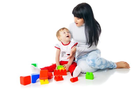 mother and baby playing with building blocks toy isolated on white