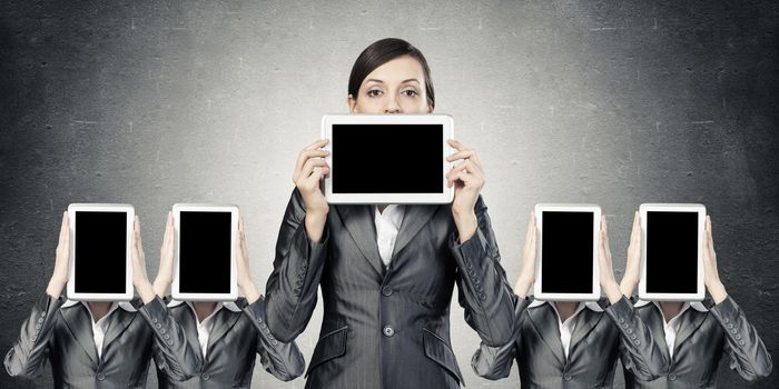 Women stand in a row. demonstrate computer tablets with cope space.