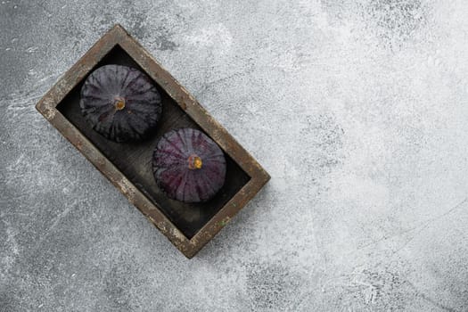 Ripe Figs set, on gray stone table background, top view flat lay, with copy space for text