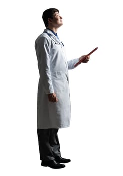 young doctor with a tablet computer, in a white medical coat and with a stethoscope