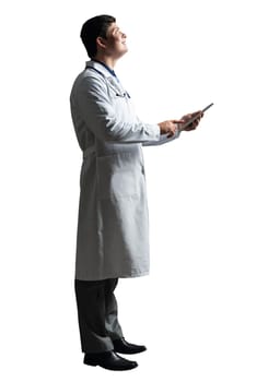 young doctor with a tablet computer, in a white medical coat and with a stethoscope