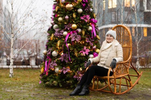 woman and christmas tree on the street