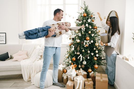 Happy family making Christmas decorations at home together, portrait