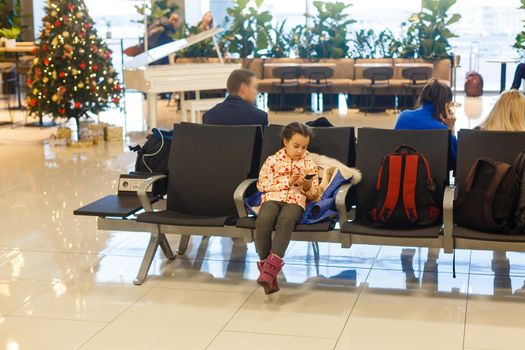 Adorable brunette little girl at airport