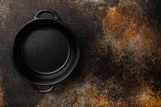 black pottery bowl set, with copy space for text or food, with copy space for text or food, top view flat lay, on old dark rustic table background