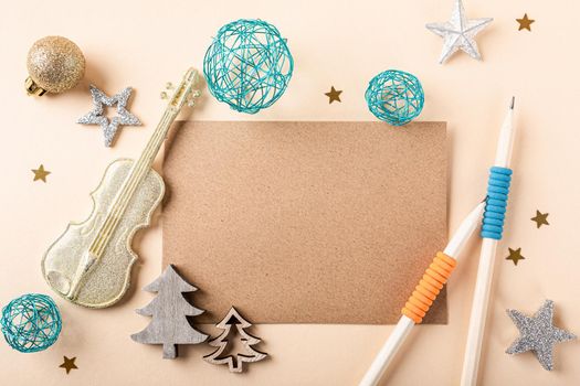 Blank kraft brown paper card with christmas decorations. Overhead shot for greeting card concept with copy space. Letter for Santa Claus