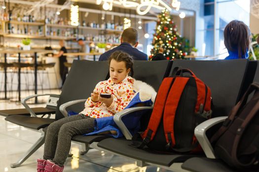 Adorable brunette little girl at airport