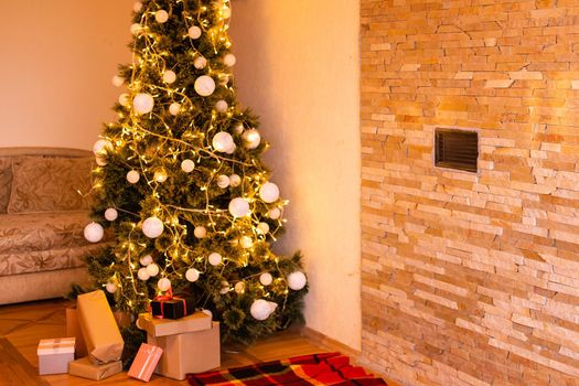 Christmas living room with a Christmas tree, gifts. Beautiful New Year decorated home interior