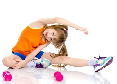 A nice little girl is performing gymnastic exercises. Concept of a healthy lifestyle, sport and fitness. Isolated on white background.