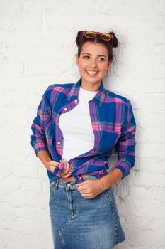 young pretty stylish hipster girl posing emotional isolated on white background happy smiling cool smile, lifestyle people concept close up