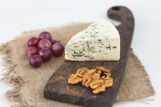 Blue cheese or brie with grapes and nuts.