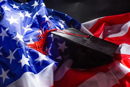 graduation hat on US flag, education concept