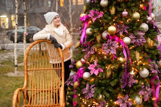 woman and christmas tree on the street