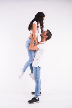 Passionate couple dancing social danse kizomba or bachata or semba or taraxia on white background.