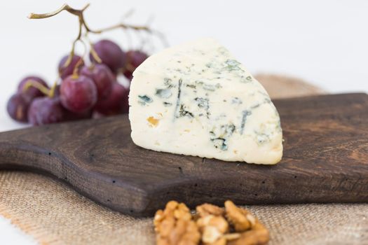 Blue cheese or brie with grapes and nuts.