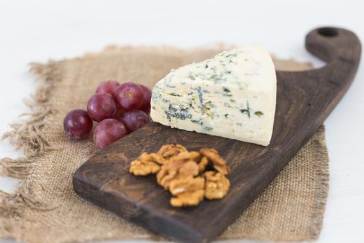 Blue cheese or brie with grapes and nuts.