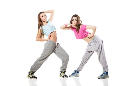 cool looking two dancing women isolated on white background