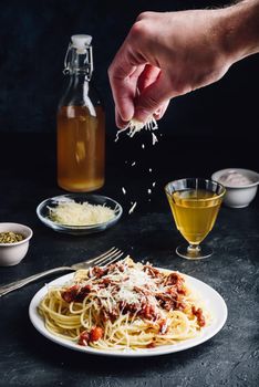 Spaghetti with bolognese sauce and grated parmesan cheese