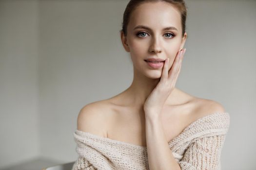 Portrait of a young pretty woman indoor in studio, skin wellness. High quality photo