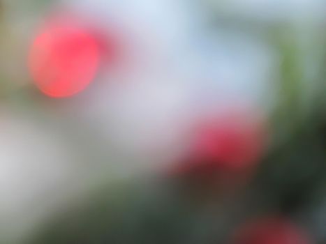 Defocused bokeh lights for backdrop. Red circles of light. Abstract and Christmas background.