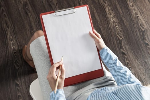 close-up a female hands with tablet and pencil